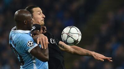 Paris Saint-Germain’s Swedish forward Zlatan Ibrahimovic (R) vies with Manchester City’s French defender Eliaquim Mangala during the Uefa Champions league quarter-final second leg football match between Manchester City and Paris Saint-Germain at the Etihad stadium in Manchester on April 12, 2016. AFP / PAUL ELLIS
