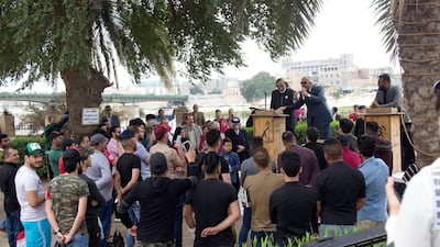 A public poetry reading in Qushla park. Charlotte Mayhew/ The National
