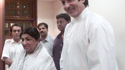 Mangeshkar with Bollywood actor Amitabh Bachchan in Mumbai in 2000. Mangeshkar holds a Guinness World Record for her more than 50,000 film tracks sung in 20 languages. Reuters