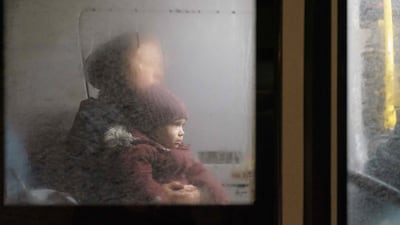 An evacuation convoy arrives at a centre for displaced people who have fled their homes amid fighting with Russia, in Zaporizhzhia, Ukraine. AFP