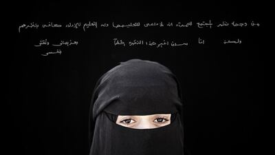 The photographer Laura Boushnak is one of the women in the Rawiya exhibit. The words on the wall read: 'Society sees that education is for boys only, but, with perseverance and self-confidence, I shall change this unsound point of view.' Courtesy Laura Boushnak / Rawiya