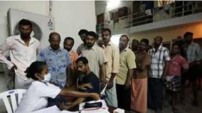 Workers in Musaffah queue for a blood-sugar check as part of the Ministry of Interior workshop.