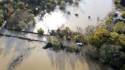 A van is stranded in floodwater from the River Adur near Shermanbury, West Sussex, on Thursday. PA