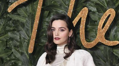 Jenna Coleman looks stunning in a retro cream silk dress with ruffle. Getty