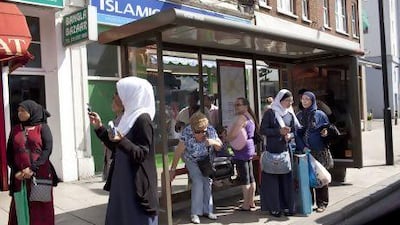 British Muslim women wait at a bus stop in the district of Tooting, London. For the first time since records began, white Britons make up less than half of London’s ethnic mix.