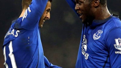 Everton's Romelu Lukaku, right, celebrates with Kevin Mirallas after scoring to give his side a 1-0 lead in an eventual 1-1 draw with Hull City in the Premier League on Wednesday at Goodison Park. Phil Noble / Reuters