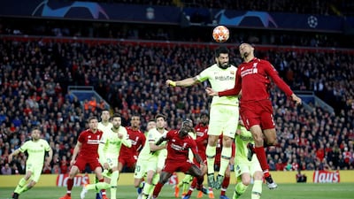 Liverpool's Fabinho fights Barcelona's Luis Suarez for possession. Reuters
