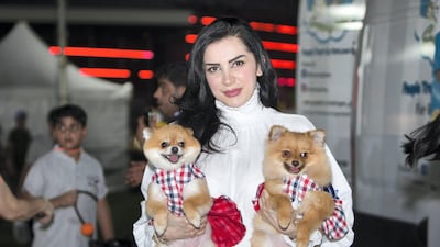 A proud pet owner with her dogs.