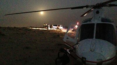 An expatriate family whose car was stuck in the sand dunes near Bab Al Shams Desert Resort was rescued by Dubai Police Air Wing. Courtesy Dubai Police Dept