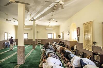Worshipers gather to pray at the Saad bin Ubadah Mosque. Antonie Robertson / The National
