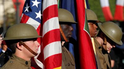 US soldiers wearing WWI helmets at the traditional Bastille Day military parade on the Champs-Elysees in Paris, France, last year. Donald Trump is planning his own triumphal military parade / Reuters
