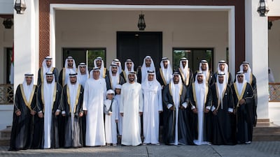 Jaber Al Suwaidi, Sheikh Nahyan bin Zayed, Chairman of the Board of Trustees of Zayed bin Sultan Al Nahyan Charitable and Humanitarian Foundation (8th L) and Ahmed Al Zaabi stand for a photograph during a mass wedding held at Majlis Al Manhal. Hamad Al Kaabi / Ministry of Presidential Affairs