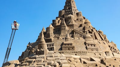 The record judges check a sand castle at the Sand Sculpture Festival in Binz on the island of Ruegen, northern Germany. The sculpture is 17.66 meters high and consists of 11,000 tons of sand. The artwork received the 'Greatest Sandcastle in the World' award from Guinness World Records. EPA