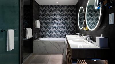 The sleek modern design carries through to the bathrooms.