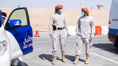 Abu Dhabi Police are making daily visits to labour sites to ensure workers are adopting safety measures. Reem Mohammed / The National