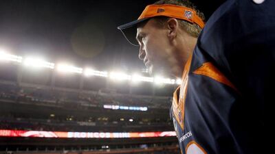 Denver Broncos quarterback Peyton Manning leaves the field after leading his team to a 42-17 win over San Francisco in the NFL on Sunday night in Denver. Joe Mahoney / AP / October 19, 2014