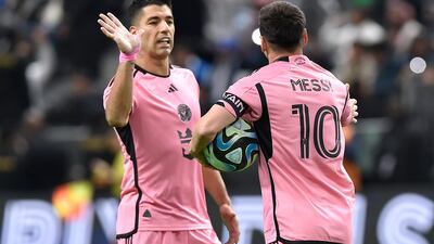 Inter Miami striker Luis Suarez, left, congratulates teammate Lionel Messi after the latter converted a penalty to make it 3-2. Al Hilal went on to win the game 4-3. EPA