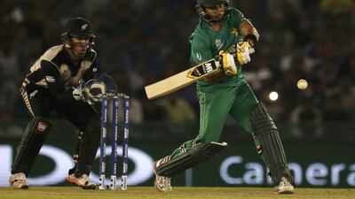 Pakistan's captain Shahid Afridi (R) plays a shot watched by New Zealand's wicketkeeper Luke Ronchi. REUTERS/Adnan Abidi