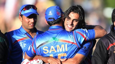 Afghanistan’s Shapoor Zadran, right, embraces teammate Samiullah Shenwari as they celebrate the team's 2015 Cricket World Cup win over Scotland on Thursday. Dianne Manson / AP / February 26, 2015