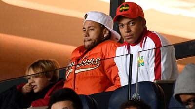 Neymar, left, and Kylian Mbappe watched Paris Saint-Germain win from the stands at the weekend but both are expected to feature against Liverpool on Wednesday. AFP