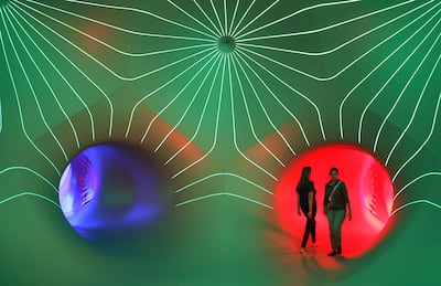 Visitors preview the LuminiMax installation by Architects of Air in Owensboro, Kentucky. AP