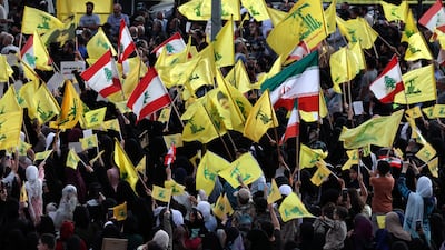 Supporters of Hezbollah wave Lebanese, Iranian and Hezbollah flags during a gathering in Beirut's southern suburbs, Lebanon. EPA