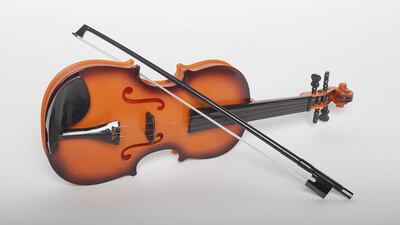 Violin: Wonderful Sound Strange Shape — Dh40 If you can get past the bad translations on the box that include: “Build the future small child star” and “This type of simulation violin is babies contact music enlightenment partner!”, then this is quite a fun gift for the money. It plays preprogrammed tunes or can be played like a traditional violin, although the instructions are a little hard to navigate and it is easier played as a guitar.