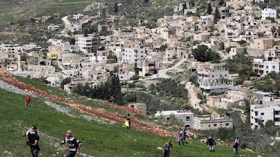 Palestinian protestors clash with Israeli security forces (not shown) in the West Bank village of Burin in March this year. Burin, a Palestinian settlement, has lost much land to Israel. Jaafar Ashtiyeh / AFP Photo / April 2014