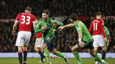 Charlie Austin, centre, celebrates with Shane Long after scoring for Southampton at Old Trafford on Saturday. Reuters / Andrew Yates