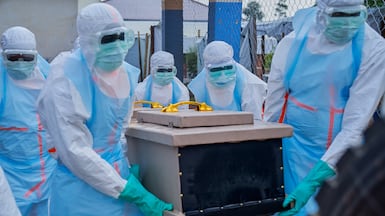 Staff lift the coffin of an Ebola victim into a vehicle at the general hospital in Bunia, Ituri, the epicentre of the Bundibugyo variant of the virus, in the Democratic Republic of Congo. EPA