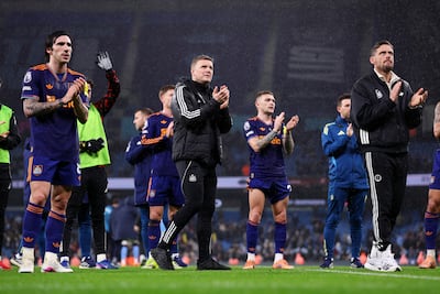 Eddie Howe, centre, and his players applaud the traavelling Newcastle fans at the end of the match. Getty Images