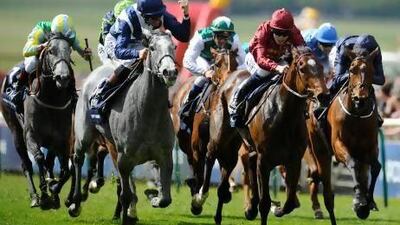 Richard Hughes rode Sky Lantern, second left, to victory in the English 1000 Guineas at Newmarket yesterday. Alan Crowhurst / Getty Images