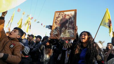 Syrian Kurds hold up a photo of jailed militant leader Abdullah Ocalan as they gather in the north-eastern city of Hasakah on Thursday. Reuters