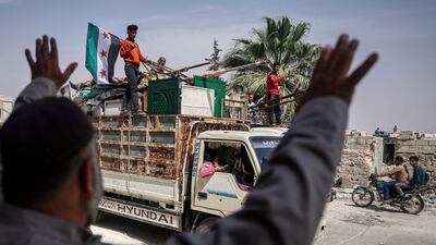 Displaced families return to their village in Kafr Sijna, south of Idlib, after more than five years in the Atmeh camps near the Syrian-Turkish border. AP