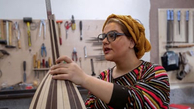 Iranian luthier Fatemeh Moussavi builds an oud at her workshop in Tehran. AFP
