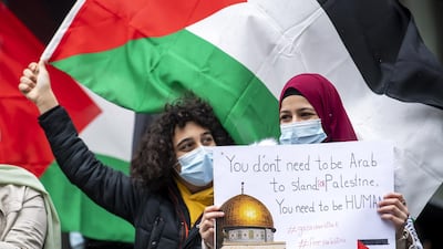 Protesters in Geneva, Switzerland, show messages of solidarity with Palestinians in their conflict with Israel. EPA