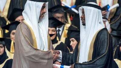 Sheikh Hamed bin Zayed, Chairman of the Crown Prince Court of Abu Dhabi and Abu Dhabi Executive Council Member (left), presents a certificate to a student during the 2018 Khalifa University Graduation ceremony at the Abu Dhabi National Exhibition Centre (Adnec).