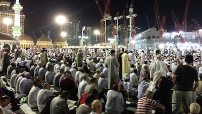 Day 14 — ‘Early this morning, people waiting for the call to start fasting in the grand mosque. Worshippers are trying to find a place to sit so they can pray or read The Quran.’ Ammar Al Attar for The National