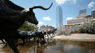 A sculpture of longhorn steers in downtown Dallas. The Texan city is a cosmopolitan urban centre. AP Photo