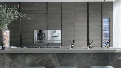 There are various textures in the ultra-modern kitchen of the show apartment. Antonie Robertson / The National