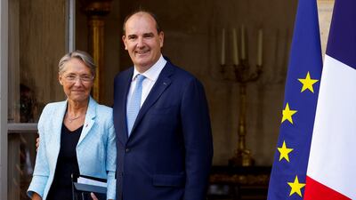 Mr Castex and Ms Borne at the handover ceremony. Reuters