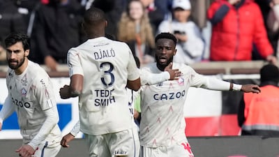 Lille's Jonathan David, right, celebrates with teammates after scoring to make it 2-2. AP