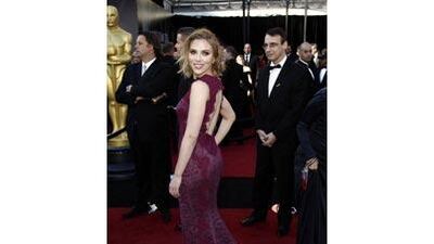 Scarlett Johansson appears uholstered on the red carpet.