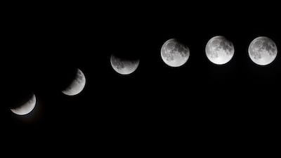 A multiple exposure image shows the phases of the partial lunar eclipse as seen from Mallorca, Spain. EPA/CATI CLADERA