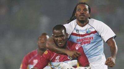 Darren Sammy, left, and Chris Gayle, proved a point on Friday. Aijaz Rahi / AP Photo