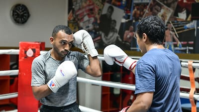 Sultan Al Nuaimi, left, during training at Round 10 Gym in Al Qouz, Dubai. All images Khushnum Bhandari / The National