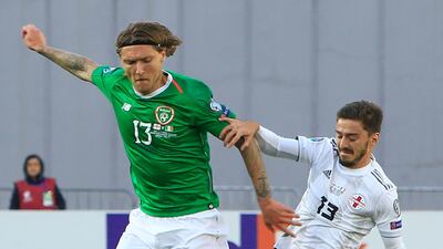 Ireland's Jeff Hendrick, left,with Otar Kiteishvili of Georgia. AP