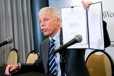 Chris Wright, US Secretary of Energy, displays a signed order approving an LNG permit extension for the Delfin LNG project, at the CeraWeek by S&P Global conference in Texas. Bloomberg