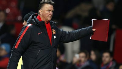 Manchester United manager Louis van Gaal leaves the pitch after his side's 3-1 win against Burnley on Wednesday at Old Trafford. Phil Noble / Reuters