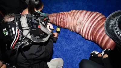 Klum still managed to speak to reporters. Invision / AP